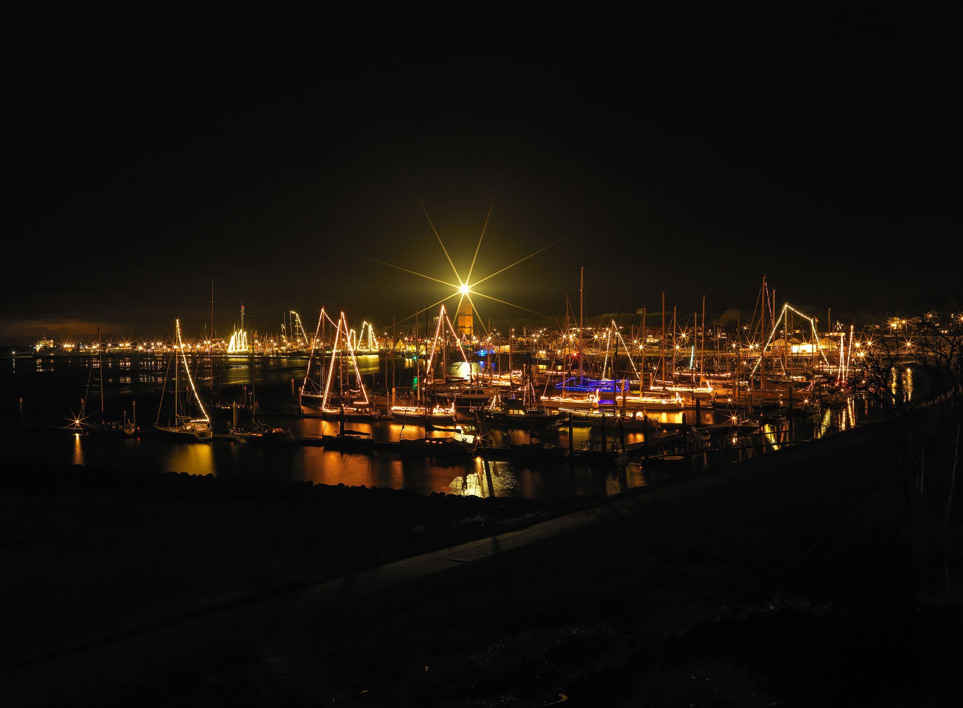Harbour lights reflected on the water at night